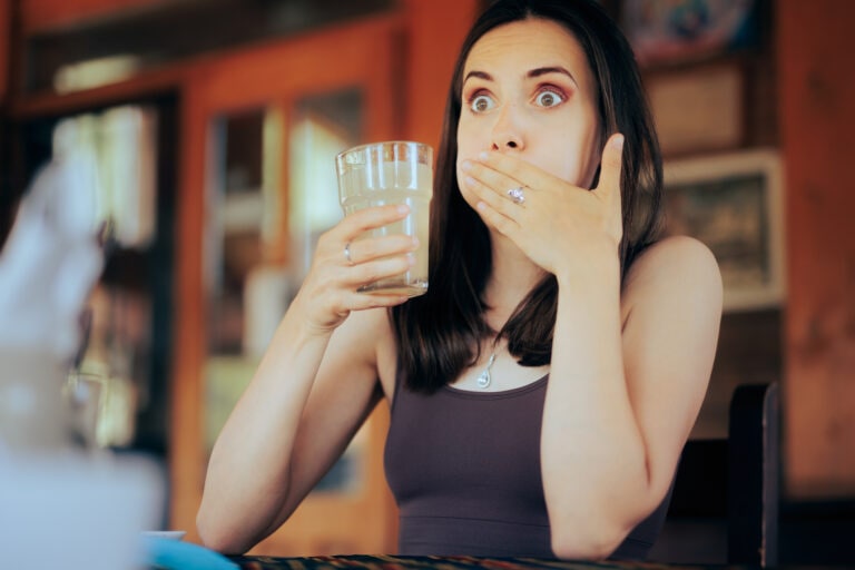 Woman reacting after hiccuping