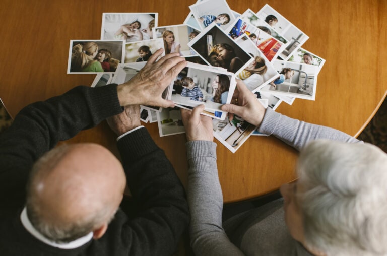 Senior couple looking at photos