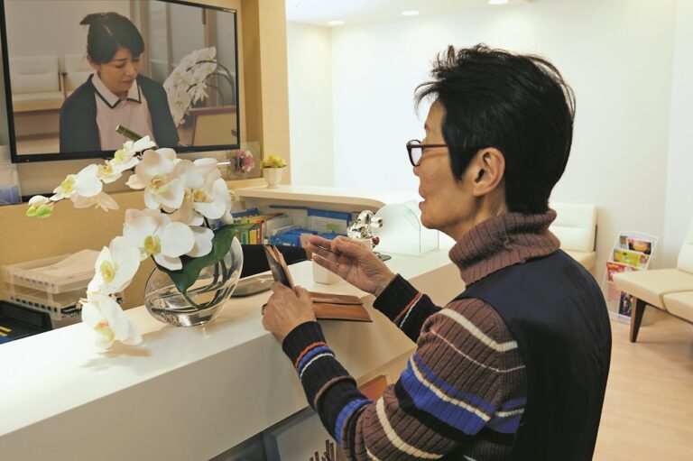 Woman in hospital contactless accounting