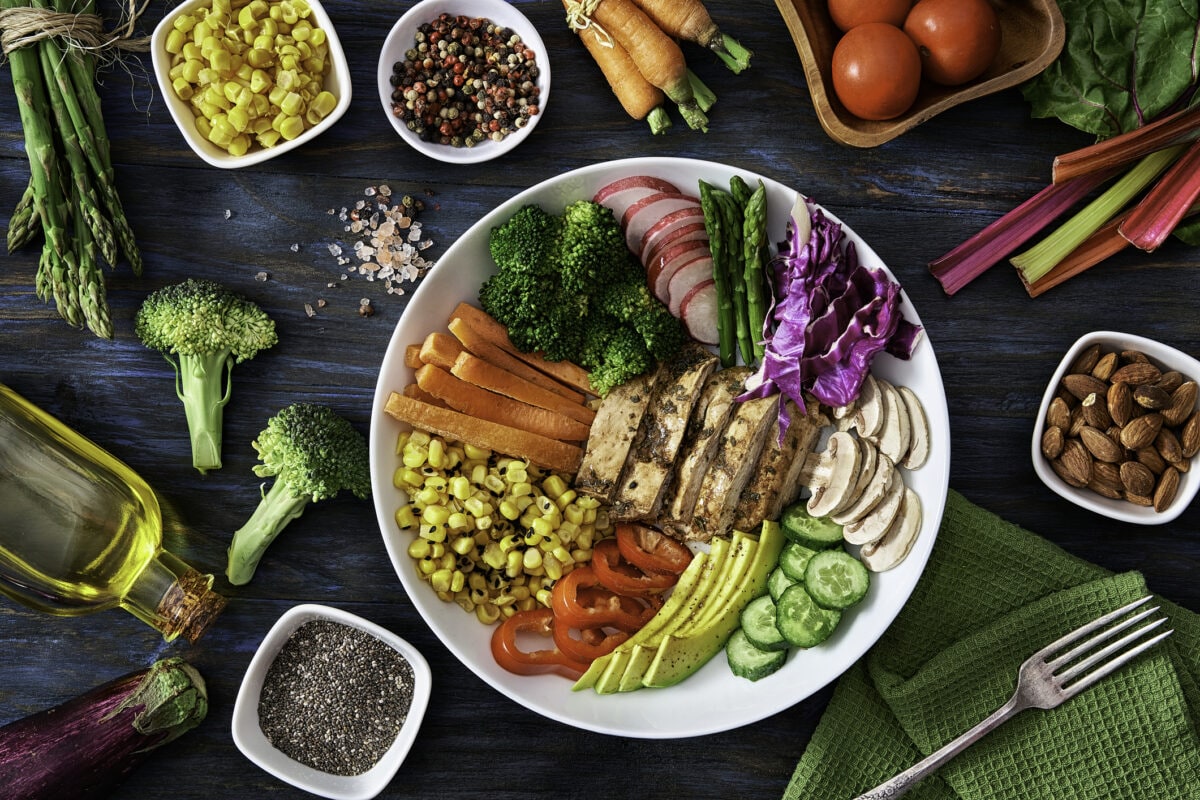 Healthy eating and diet concepts. Top view of spring salad shot from above on rustic wood table.