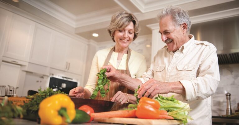 Mature  couple  preparing a salad