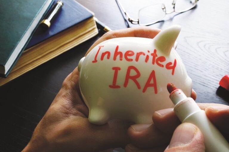 Inherited IRA written on a piggy bank.
