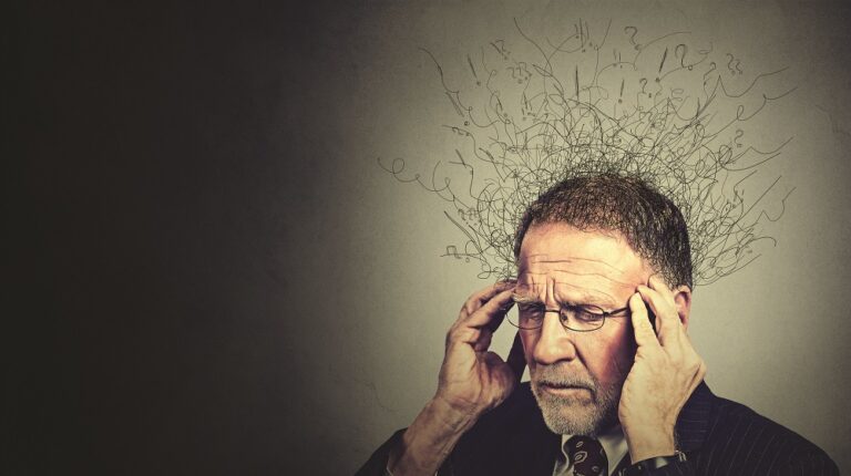 elderly man worried stressed face expression looking down