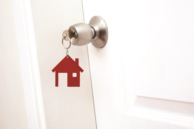 Keys to the apartment in the door, estate concept