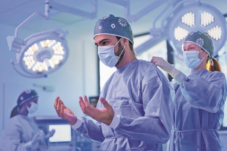 Close-up of surgeon preparing for operation.
