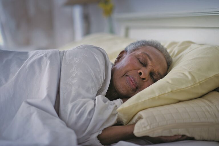 Black woman sleeping in bed