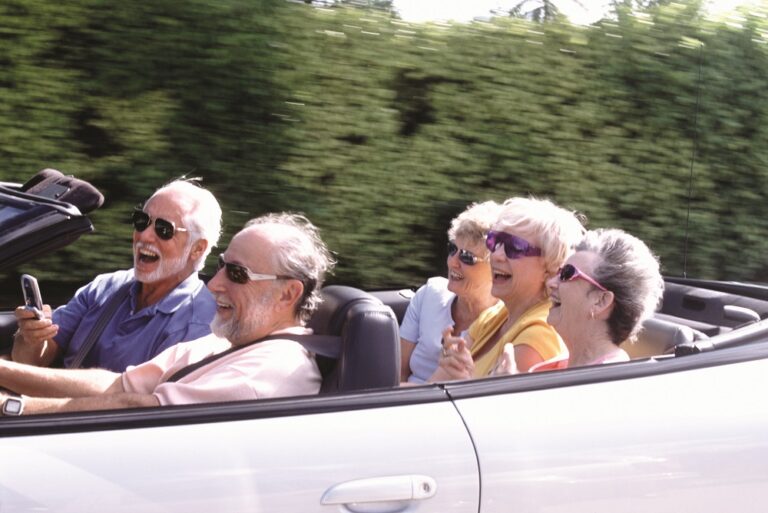Seniors Riding in Convertible