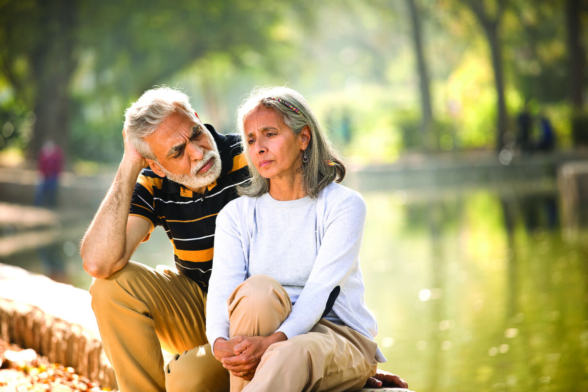 Senior man consoling his angry wife