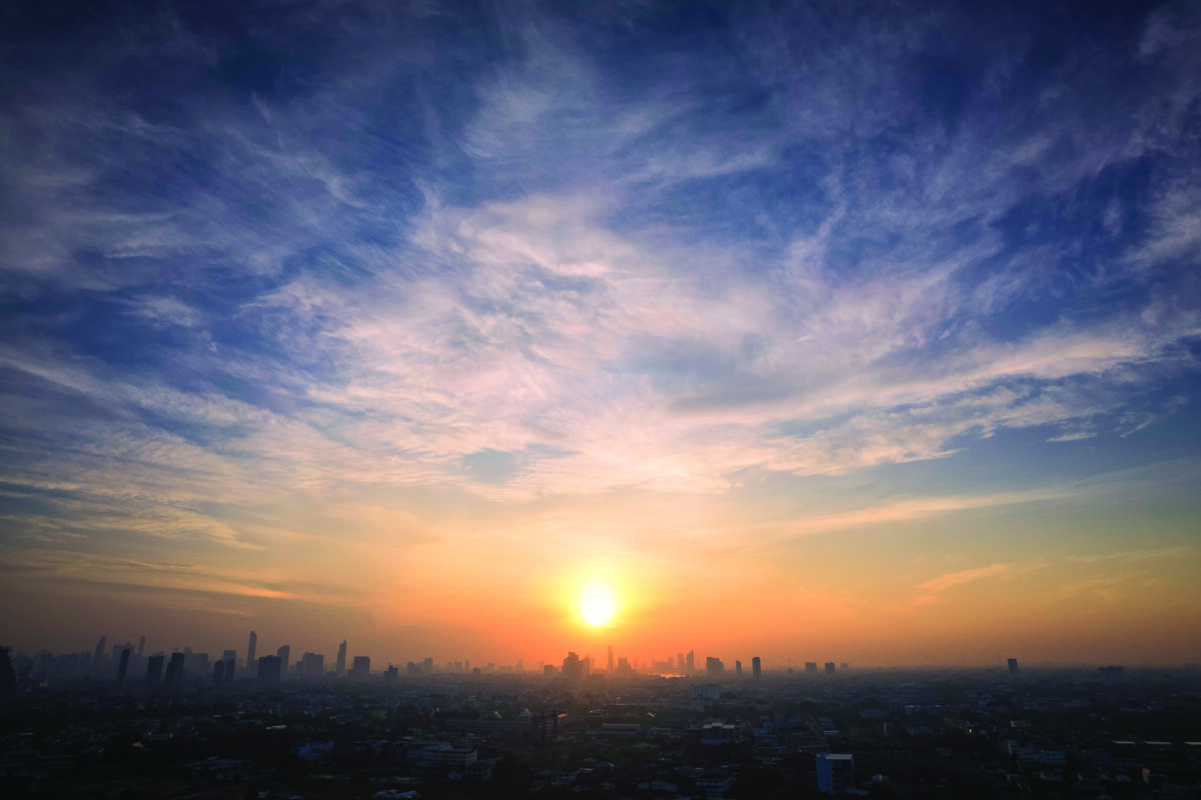 Sunrise with cloudscape from above city