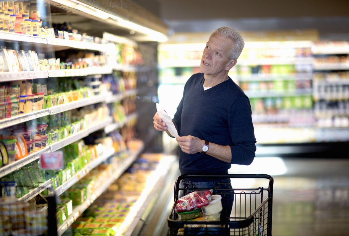 Senior man goes grocery shopping.