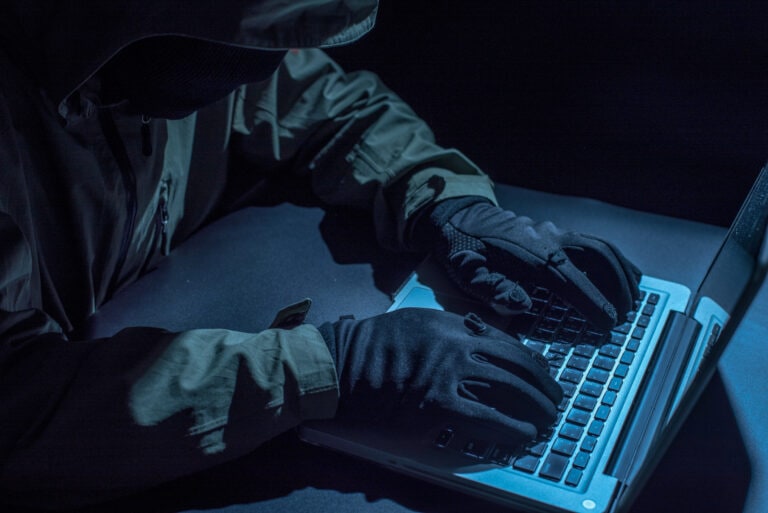 Hacker stealing password and identity, computer crime
