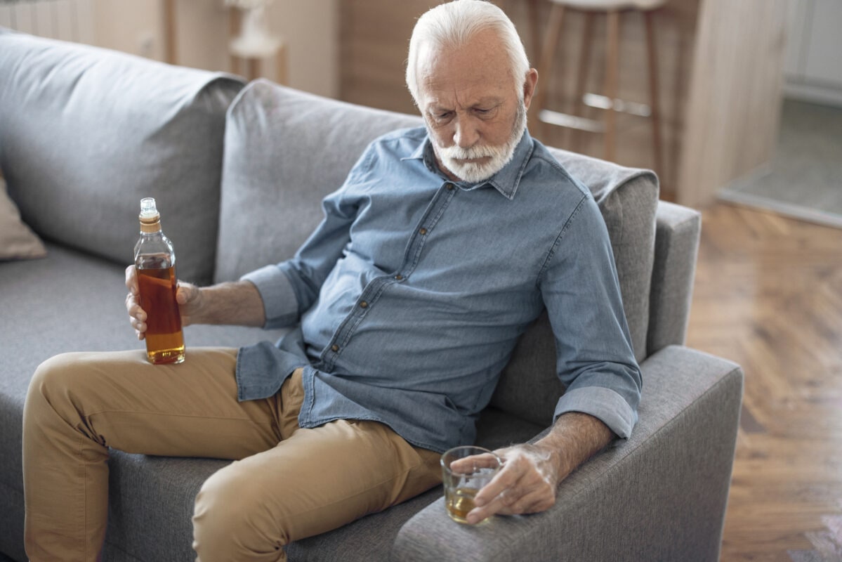 Drunk Senior Man in Depressed Expression