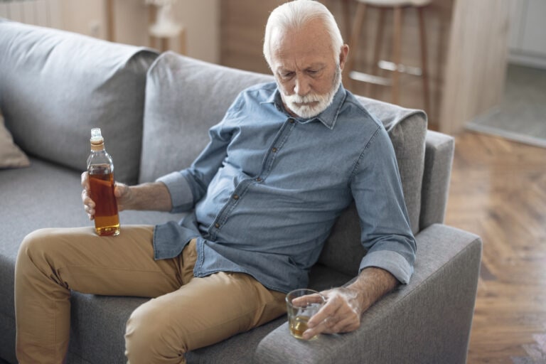 Drunk Senior Man in Depressed Expression