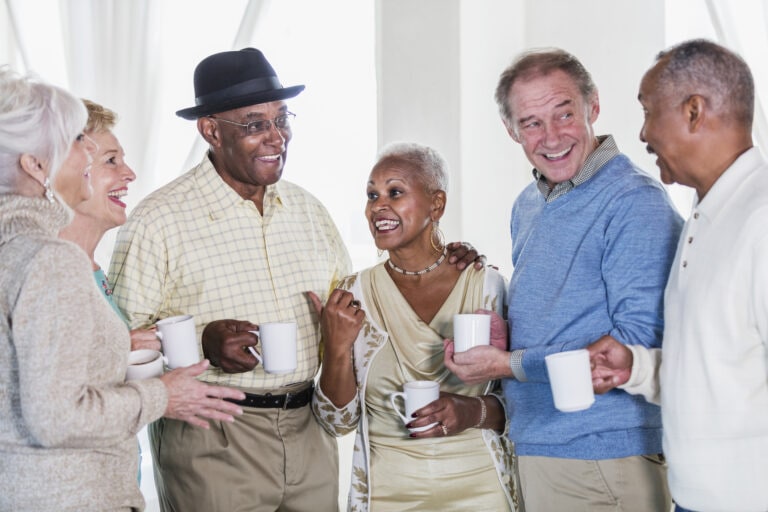 Group of seniors socializing over coffee