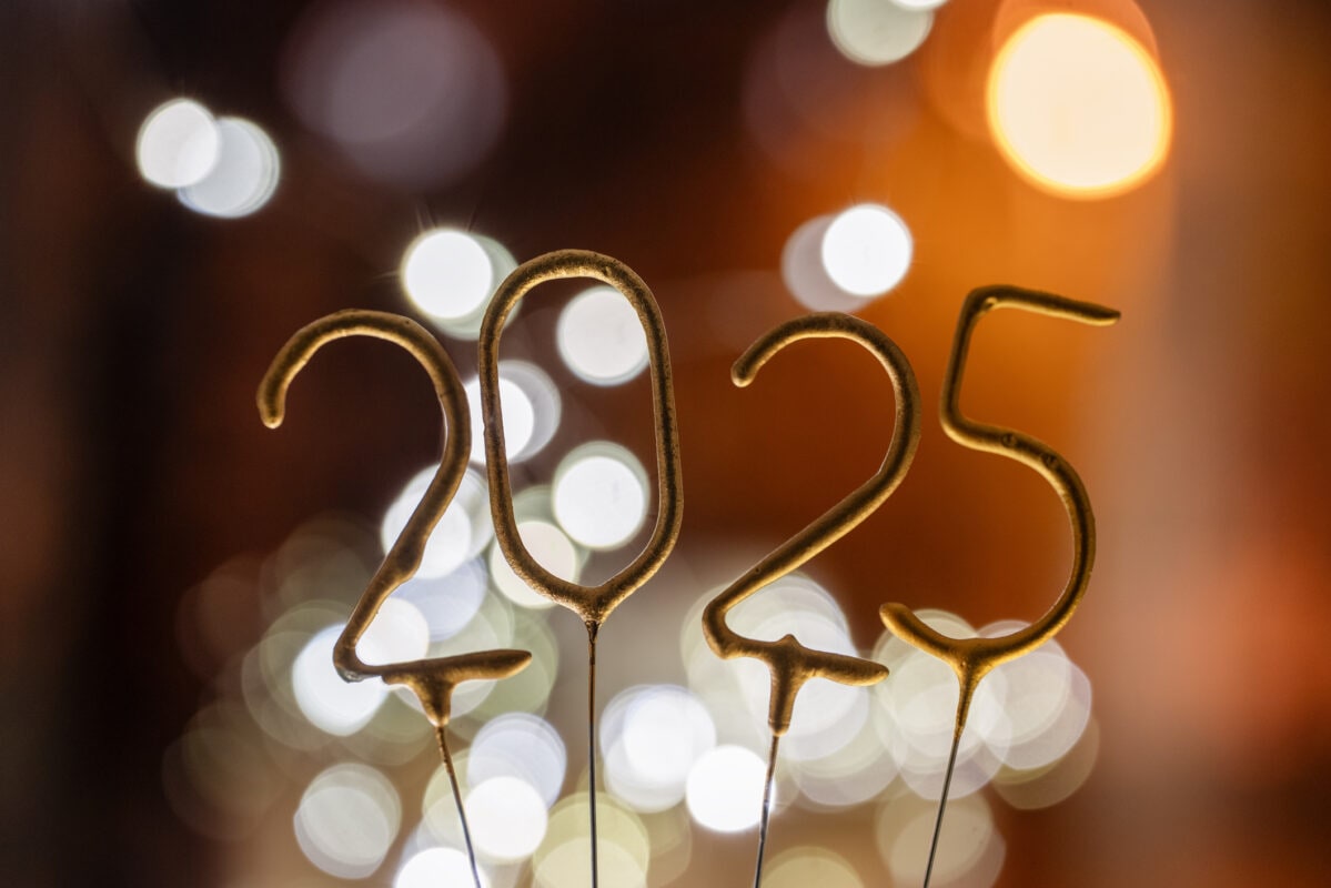 Golden 2025 sparkle against a vibrant background celebrating the New Year