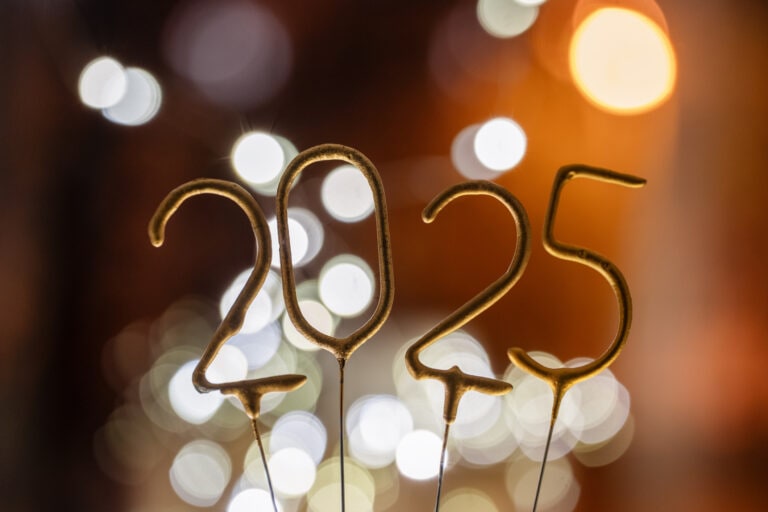 Golden 2025 sparkle against a vibrant background celebrating the New Year