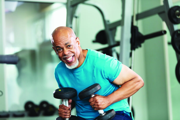 Senior African-American man working out at gym