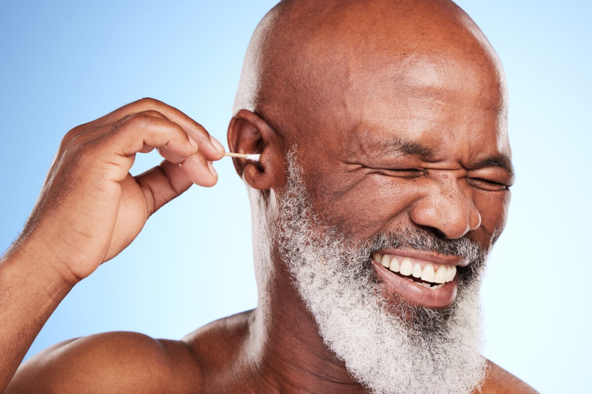 Cropped shot of a handsome mature man posing in studio against a blue background