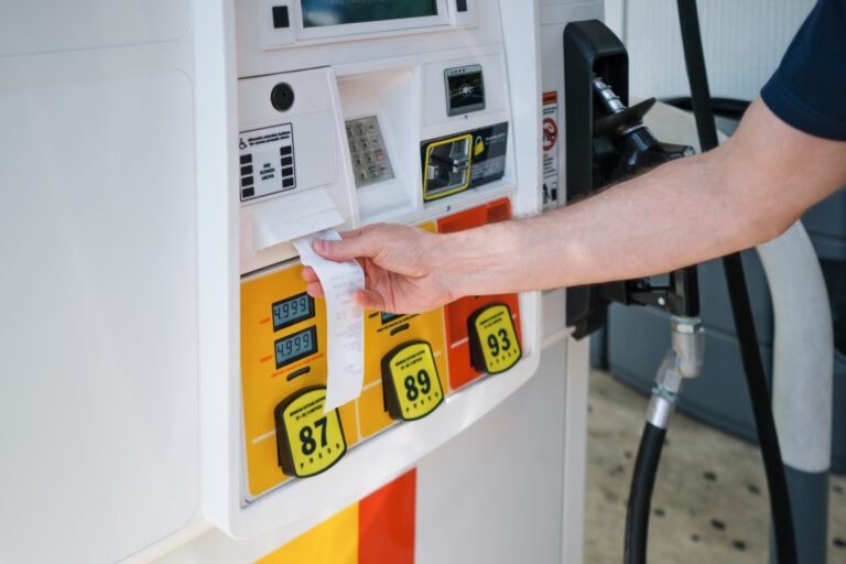 Man Purchases Gas at Pump Amid Skyrocketing Prices