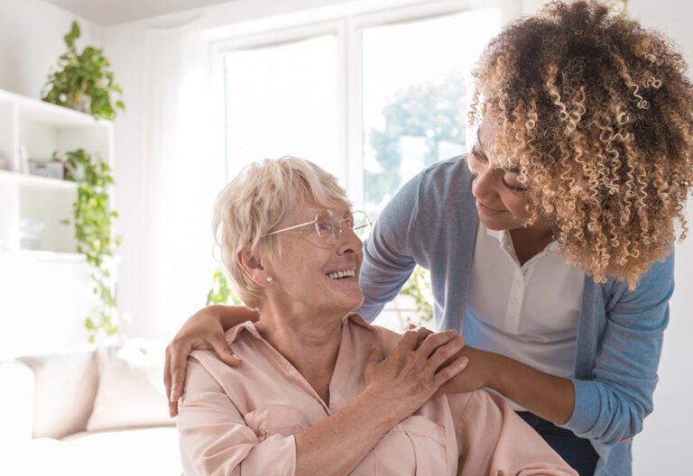 Young woman caring for an elderly woman