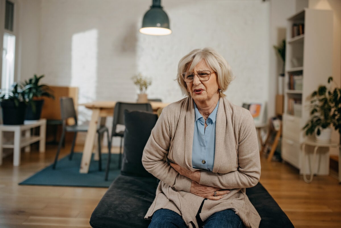 Senior woman having stomachache