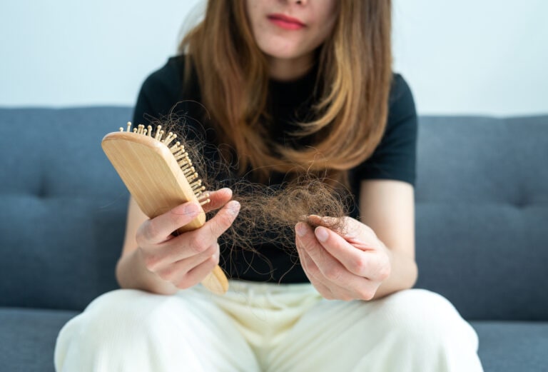 Hair loss in women can be caused by family history, stress, immune disorders, or other issues.